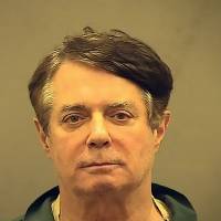 This photograph obtained courtesy of the Alexandria Sheriff\'s Office, Paul Manafort, Donald Trump\'s former campaign chief, is seen in this booking photo Thursday after his transfer to the Alexandria Detention Center in Alexandria, Virginia. Manafort, who is facing trial later this year on money laundering charges involving his work for Ukraine that predated the 2016 presidential election, is one of 20 people and three companies already indicted by special counsel Robert Mueller in the investigation into possible collusion with Russia by the Trump campaign, as well as possible obstruction of justice. | ALEXANDRIA SHERIFF\'S OFFICE / HO / AFP-JIJI