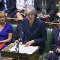 British Prime Minister Theresa May gives a statement to parliament on Monday. British Foreign Secretary Boris Johnson resigned the same day, adding to divisions over Brexit that threaten to tear apart Prime Minister Theresa May\'s government. | AP