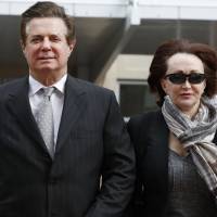 Paul Manafort, President Donald Trump\'s former campaign chairman, walks with this wife, Kathleen Manafort, as they arrive at the Alexandria Federal Courthouse in Alexandria, Virgina, in March. Special counsel Robert Mueller is seeking immunity for five potential witnesses in the upcoming trial of Manafort. Mueller\'s office told a federal judge in Virginia on Tuesday that they were seeking to compel the witnesses to testify under condition of immunity. | AP
