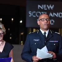 The U.K.\'s head of counterterrorism policing, Neil Basu, and chief medical officer for England Dame Sally Davies hold a news conference at New Scotland Yard in London Wednesday. British police say a couple who are critically ill were exposed to the Russian nerve agent Novichok. | JOHN STILLWELL / PA / VIA AP
