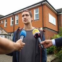 Sam Hobson talks to the media outside the Amesbury Baptist Center in Amesbury, southern England, on Wednesday, identifying himself as a friend of two people who were found unconcious at a residence in the town under circumstances that sparked a major incident. | AFP-JIJI