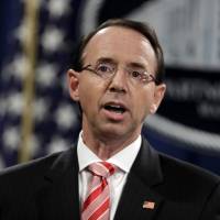 Deputy Attorney General Rod Rosenstein speaks during a news conference at the Department of Justice in Washington July 13. Rosenstein is defending the prosecution of foreign agents who may never see the inside of a U.S. courtroom. He says the prosecutions of agents involved in efforts to sow dissent in the U.S. political system or in cyberattacks serves as a deterrent even when they are beyond the reach of U.S. authorities. | AP
