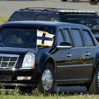 The U.S. Presidential limousine, a black Cadillac also known as \"The Beast,\" is seen prior to the arrival of U.S. President Donald Trump on the tarmac of the Helsinki International Airport in Vantaa, Finland, Sunday. | LEHTIKUVA / HEIKKI SAUKKOMAA / VIA REUTERS