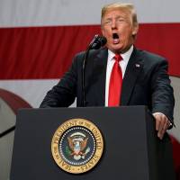 U.S. President Donald Trump speaks about trade at the Granite City Works steel coil warehouse in Granite City, Illinois, Thursday. | REUTERS