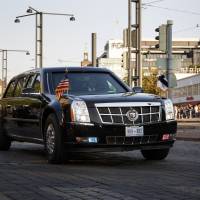 A presidential state car carrying U.S. President Donald Trump passes after the summit with Russia\'s President Vladimir Putin in Helsinki Monday. | LEHTIKUVA / ALEKSI TUOMOLA / VIA REUTERS