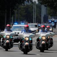 U.S. President Donald Trump\'s motorcade departs for Brussels Military Airport in Melsbroek, Belgium, after his attendance at the second day of a NATO summit on July 12, 2018. | REUTERS