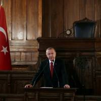 Turkish President Tayyip Erdogan makes a speech at the old parliament building in Ankara on Friday. | REUTERS