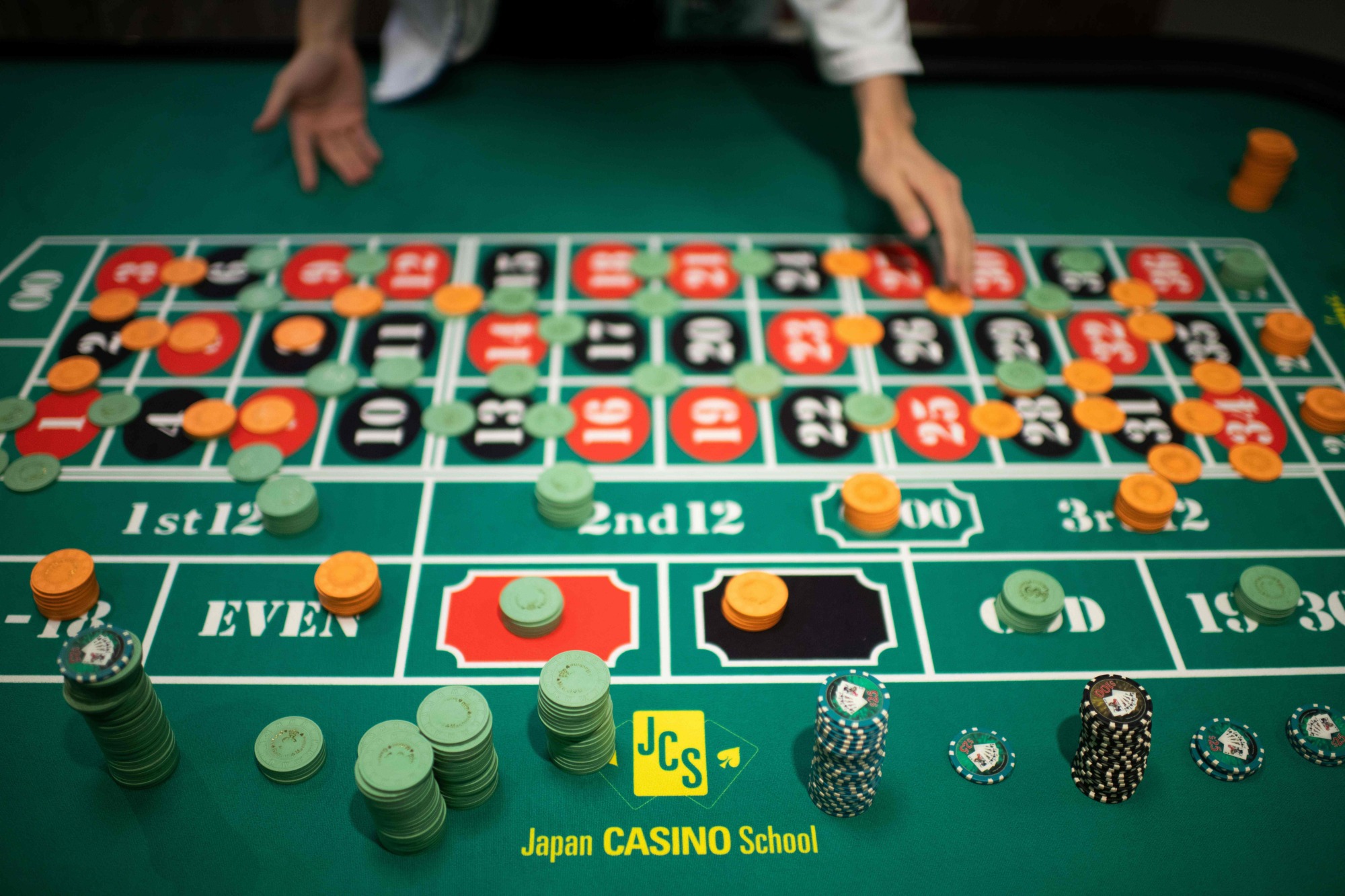 A student practices roulette at the Japan Casino School in Tokyo in June. | AFP-JIJI