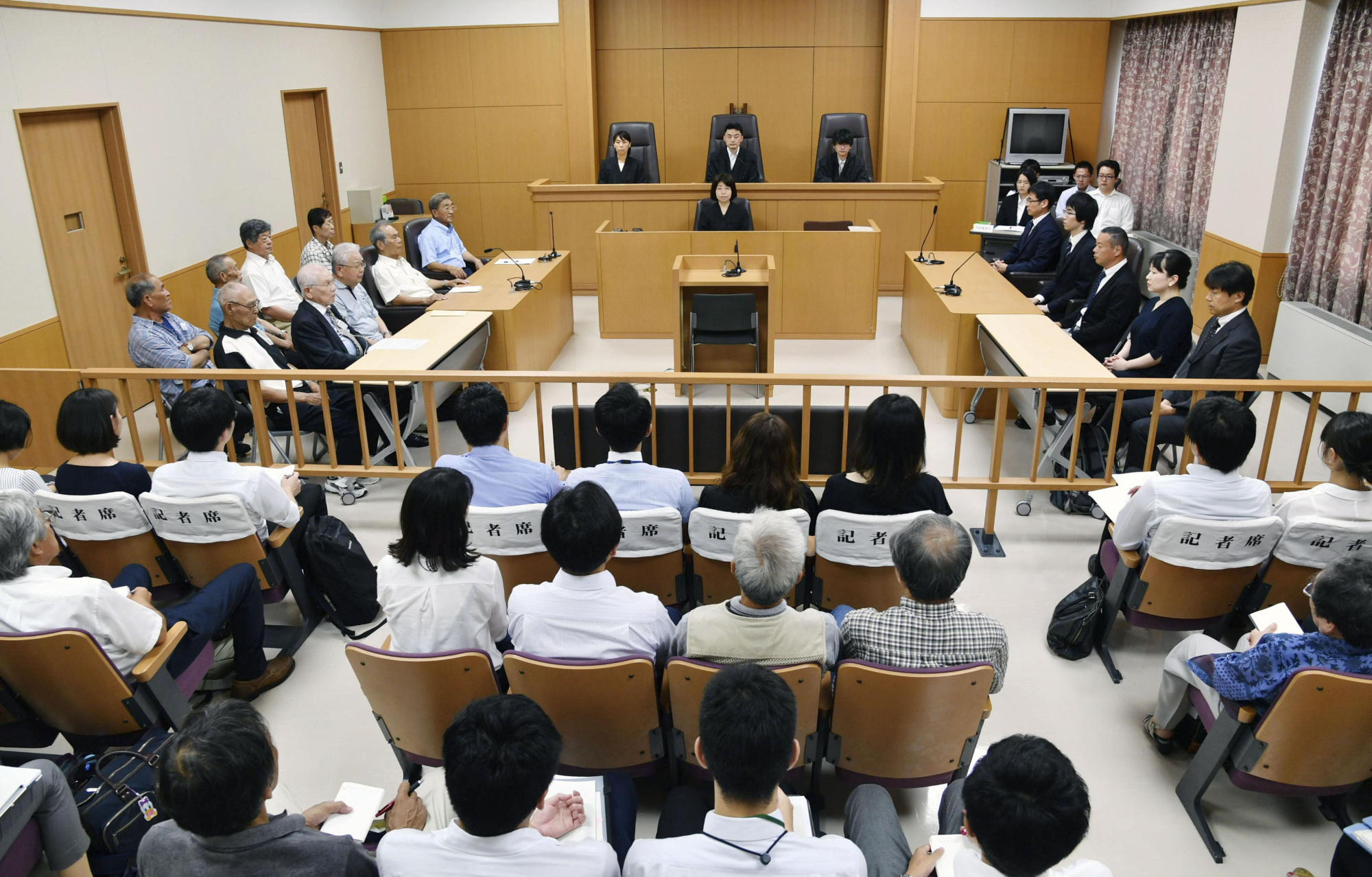 The Kochi District Court sits in session on Friday before it rejected a damages suit filed by former fishermen and their families claiming the fishermen were exposed to radiation in the 1954 U.S. hydrogen bomb tests in the Pacific. | KYODO