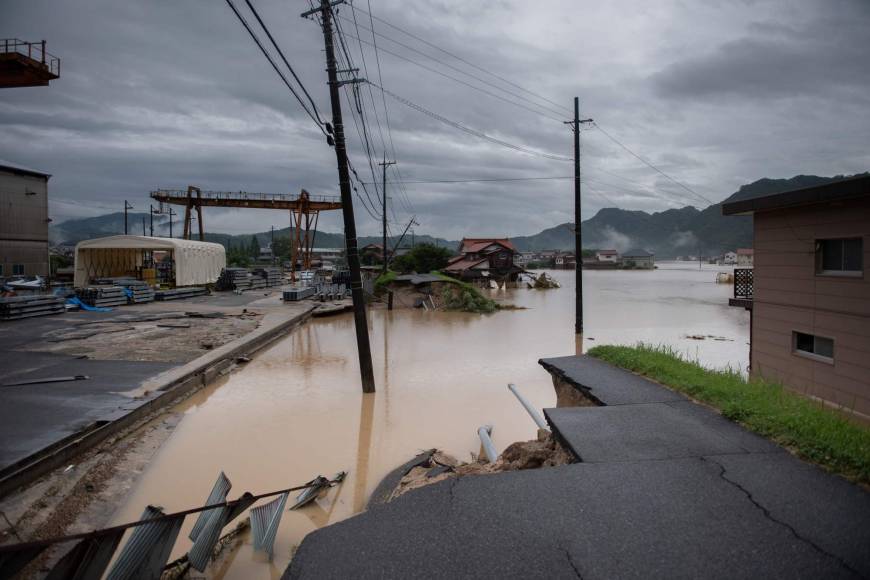 A washed out road is seen following heavy rains and flooding in Mihara, Hiroshima Prefecture, on Sunday.