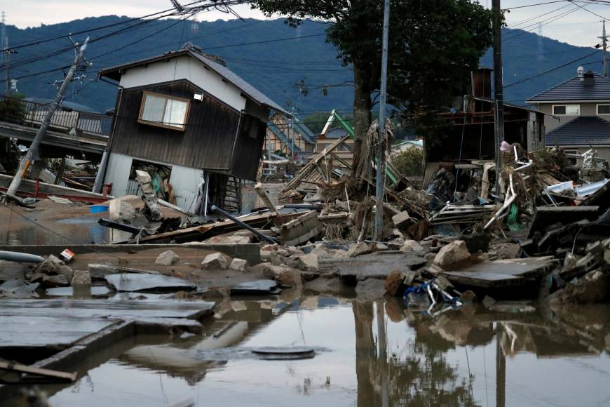 Submerged and destroyed houses are seen in a flooded area of Kurashiki, Okayama Prefecture, on Sunday.