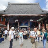 People visit Sensoji Temple in Tokyo\'s Asakusa district. A record number of foreign tourists visited Japan in the January to June period, according to government data released Wednesday. | YOSHIAKI MIURA