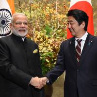 Prime Minister Shinzo Abe and his Indian counterpart, Narendra Modi, are deepening ties between Tokyo and New Delhi. | VIA BLOOMBERG