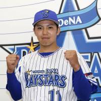 Yokohama rookie Katsuki Azuma poses after being named to the Central League All-Star roster on Monday. | KYODO