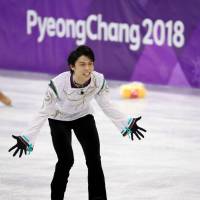 Yuzuru Hanyu reacts after his free skate at the Pyeongchang Games, where he became the first man in 66 years to defend the Olympic title. Hanyu will compete in the Helsinki Grand Prix and Cup of Russia in Moscow this season. | AP