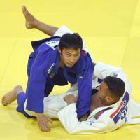 Naohisa Takato (left), seen in a file photo from the World Judo Championships in August 2017 in Budapest, earned the men\'s 60-kg title on Friday at the Zagreb Grand Prix, a three-day weekend event. | AFP-JIJI