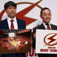 New Kawasaki Brave Thunders president Nobuo Motozawa (right) and head coach Takuya Kita pose for photos during a news conference on Wednesday. | KAZ NAGATSUKA
