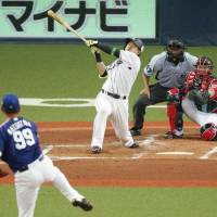 Pacific League catcher Tomoya Mori blasts a three-run homer off Central League starter Daisuke Matsuzaka in the first inning of the NPB All-Star Series opener in Osaka on Friday night. | KYODO