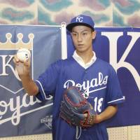Sixteen-year-old pitcher Kaito Yuki poses for a picture in Osaka Prefecture on Sunday after signing a minor league deal with the Kansas City Royals. | KYODO