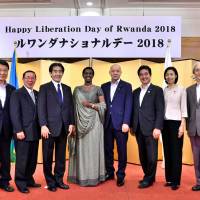 Rwandan Ambassador Venetia Sebudandi (fourth from left) poses for a photo with Hachimantai Mayor Masahiko Tamura (second from left); Manabu Horii (fourth from right), vice minister for foreign affairs; Manabu Sakai (third from right), state minister for international affairs and communications; Lower House lawmaker Emi Kaneko (second from right); Masahiko Tominaga (right), vice-minister for policy coordination at the  Ministry of International Affairs and Communications; and members of the Japan-African Friendship Association during a reception to celebrate Rwanda\'s independence day at Hotel Le Port Kojimachi on July 4. | YOSHIAKI MIURA