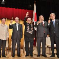 Philippines Ambassador Jose C. Laurel V (center) poses for a photo with (from left) Philippines Finance Secretary Carlos G. Dominguez III; former Prime Minister Yasuo Fukuda; Salvador C. Medialdea, executive secretary of the Philippines; and Nobuteru Ishihara, chairman of the Japan-Philippines Friendship League, during a reception to celebrate the 120th anniversary of independence of the Philippines at the Imperial Hotel, Tokyo on June 20. | YOSHIAKI MIURA