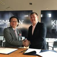 Masayuki Tsukada , president and CEO of Tsukada Global Holdings Inc. (left), and Kenneth Macpherson, CEO of Europe, Middle East, Asia and Africa at IHG, pose for a photo during a news conference on July 19 to announce their alliance in operating Kimpton Tokyo Shinjuku, a boutique hotel scheduled to open in 2020. | AYUMI KIMURA