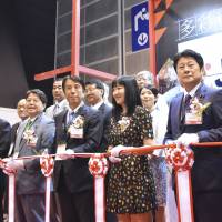 Agriculture, Forestry and Fisheries Minister Ken Saito (front, third from left) attends the opening ceremony of the Japan pavilion at Food Expo 2018 in Hong Kong on Thursday. | KYODO