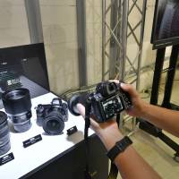 The Z system, with its larger lens mount, will allow the company to develop “a new dimension in optical performance,” Nikon President and Representative Director Kazuo Ushida said at a news conference in Tokyo. | YOSHIAKI MIURA
