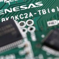 Renesas Electronics chips are arranged on a circuit board. The company is reportedly in talks to acquire U.S. peer Integrated Device Technology for around &#36;5.5 billion. | BLOOMBERG
