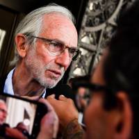 Italian architect Renzo Piano talks with journalists after a meeting about the Morandi highway bridge, which collapsed on Aug. 14 killing 43 people, in Genoa, Italy, Tuesday.  | SIMONE ARVEDA / ANSA / VIA AP