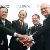 Presidents of four auto parts suppliers affiliated with Toyota Motor Corp. &#8212; Advics Co. Ltd., Denso Corp., Jtekt Corp., and Aisin Seiki Co. Ltd. &#8212; pose during a news conference in Nagoya, Aichi Prefecture, on Monday. | KYODO