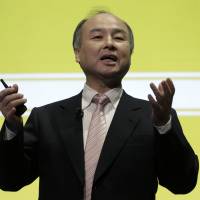 Masayoshi Son, chairman and CEO of SoftBank Group Corp., gestures at a news conference in Tokyo in February 2016. | BLOOMBERG