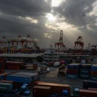 A shipping terminal in Yokohama is seen in April. Japan\'s current account surplus increased in the first half of 2018 on the back of foreign investments. | BLOOMBERG
