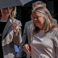 Cindy Laporta, an accountant for former Donald Trump campaign manager Paul Manafort, exits the U.S. Attorneys Building in Alexandria, Virginia, on Monday. Laporta last week recalled how she felt conflicted after Manafort\'s right-hand man, Rick Gates, sent her phony, backdated loan documents that would lower his taxes and help him get a bank loan as his income plunged. | BLOOMBERG