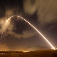 Israel\'s Iron Dome anti-missile system fires an interceptor missile as rockets are launched from Gaza toward Israel near the southern city of Sderot on Thursday. | REUTERS