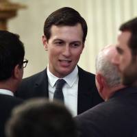 White House adviser Jared Kushner speaks with people as they wait for President Donald Trump to arrive to speak about taxes during an event in the East Room of the White House in Washington in June. U.S. officials say the Trump administration is staffing up a Middle East team at the White House in anticipation of rolling out its much-heralded but largely mysterious Israeli-Palestinian peace plan in the coming months. The National Security Council began last week to approach other agencies seeking volunteers to join the team, which will work for Trump\'s Mideast peace pointmen Kushner and Jason Greenblatt, according to the officials. | AP