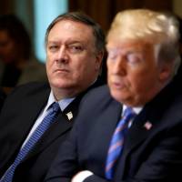 U.S. Secretary of State Mike Pompeo listens as President Donald Trump speaks during a Cabinet meeting at the White House in Washington last month. | REUTERS