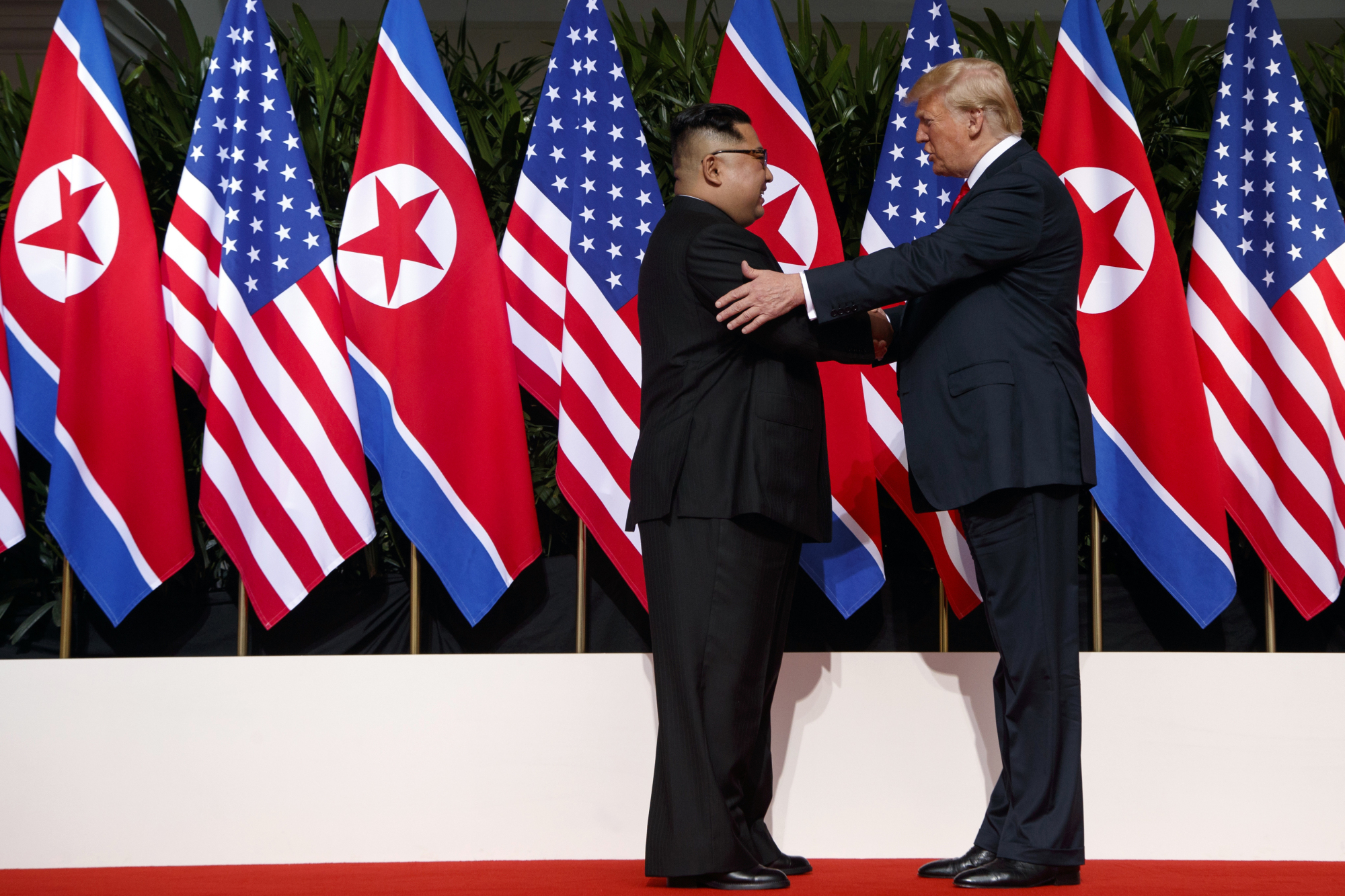 U.S. President Donald Trump meets with North Korean leader Kim Jong Un on Sentosa Island, in Singapore, on June 12. | AP