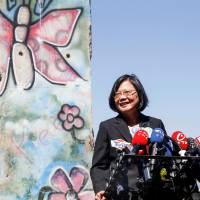 Taiwanese President Tsai Ing-wen, standing by a section of the Berlin Wall, speaks to media at the Ronald Reagan Presidential Library in Simi Valley, California, on Monday. | REUTERS