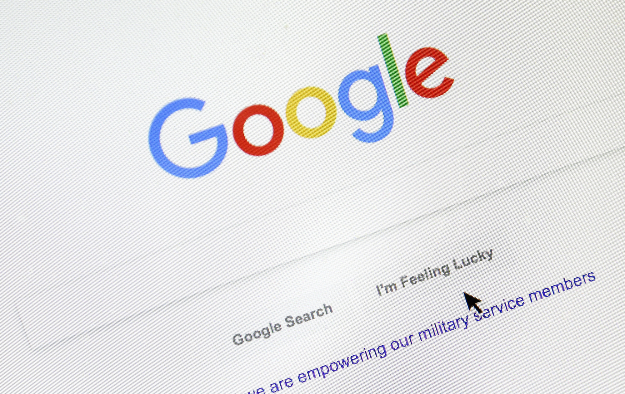 A cursor moves over Google's search engine page on Tuesday in Portland, Oregon. Political leanings don't factor into Google's search algorithm. But the authoritativeness of page links the algorithm spits out and the perception of thousands of human raters do. | DON RYAN / VIA AP