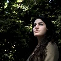 French woman Marie Laguerre, who posted online a video in which she is seen being hit by a man in the street, poses for pictures in Paris Aug. 1. A man has been detained on suspicion of assaulting the 22-year-old student who released a shocking video of the attack last month outside a Paris cafe that went viral online. Surveillance footage of the incident shows a man hurling an ashtray from a table outside the cafe at Marie Laguerre, allegedly after she told him to \"shut up\" following lewd comments. | ALAIN JOCARD / VIA AFP-JIJI