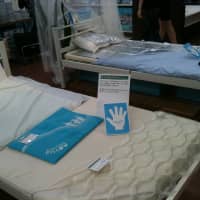 Mattress toppers in different materials, from plain water in rubber casing to a self-cooling gel coated in thin foil that get tucked under bed sheets. | KYODO