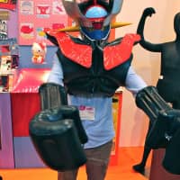 Inflatable armor allows adults to dress up as childhood hero Majingah-Z. | AP