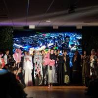 Waseda University student Eri Tamazawa (center) wears kimono-inspired abaya during her Tokyo Arabian Night fashion show on July 26 in the Roppongi district. | KANTARO KOMIYA