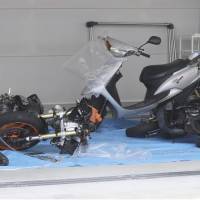 Two damaged motorcycles and a scooter involved in a fatal accident in the city of Nara on Friday are displayed to the media. | KYODO