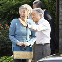 Emperor Akihito and Empress Michiko are seen visiting a park in Tokyo\'s Shinagawa Ward in June. | KYODO