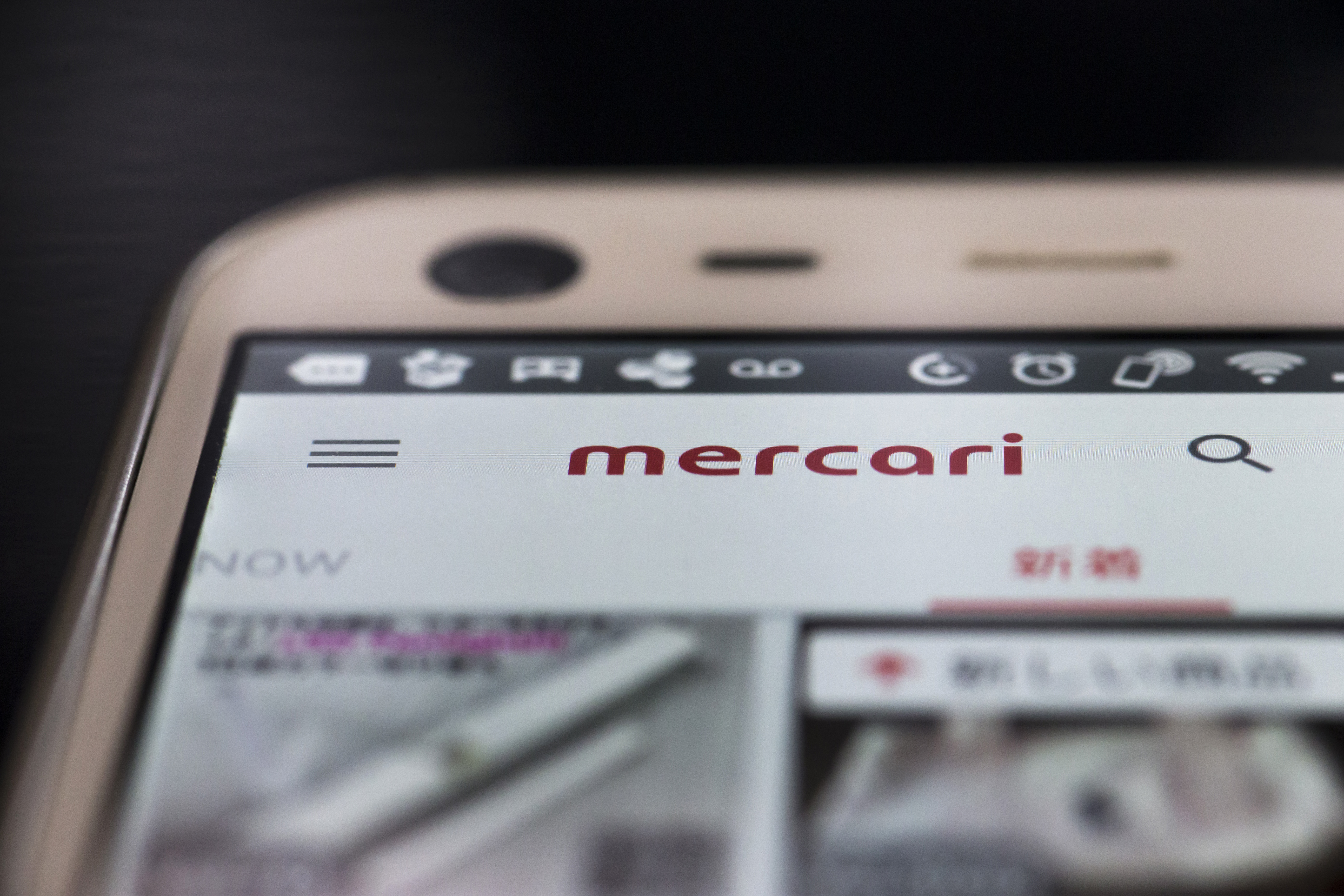 The Mercari flea-market app is seen on a smartphone screen. Homework-by-proxy is said to be rampant on the internet, with services aimed at busy parents of school students desperate for help completing their assignments at the end of summer recess. | BLOOMBERG