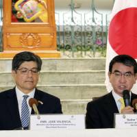 Foreign Minister Taro Kono (right) speaks during a joint news conference with his Ecuadorian counterpart, Jose Valencia, after their meeting in Quito on Monday. | KYODO