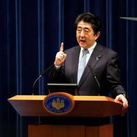 Prime Minister Shinzo Abe speaks at a news conference in Tokyo on July 20. | REUTERS