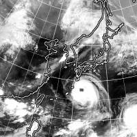 Two typhoons are seen approaching Japan in this satellite image captured on Aug. 21. | KYODO